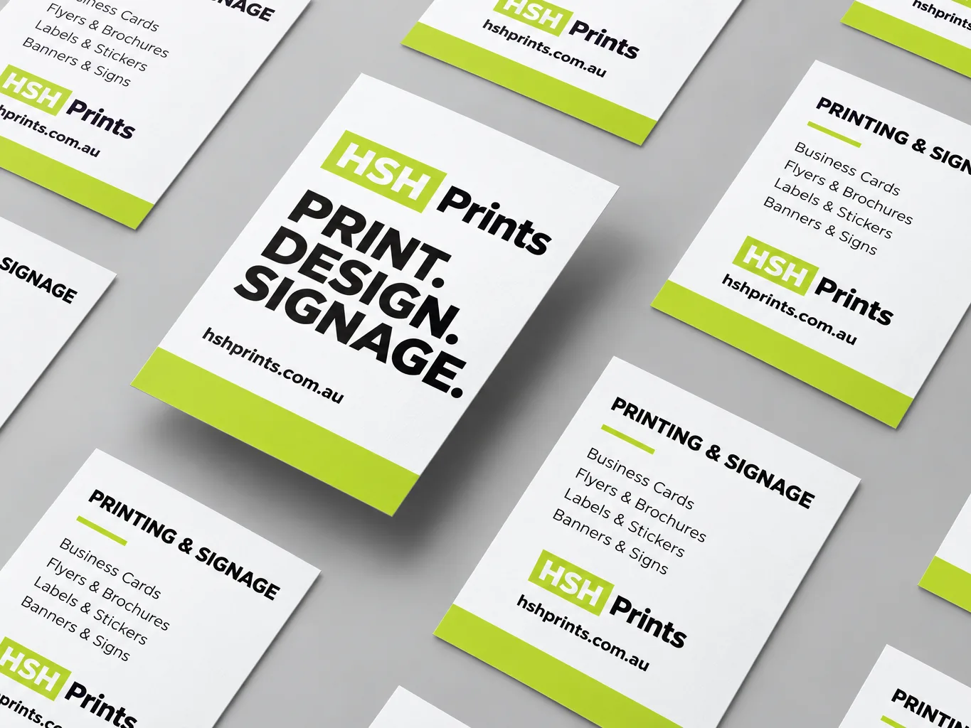 Mockup of HSH flyers laid out in rows on a grey surface, white with a lime band at the foot