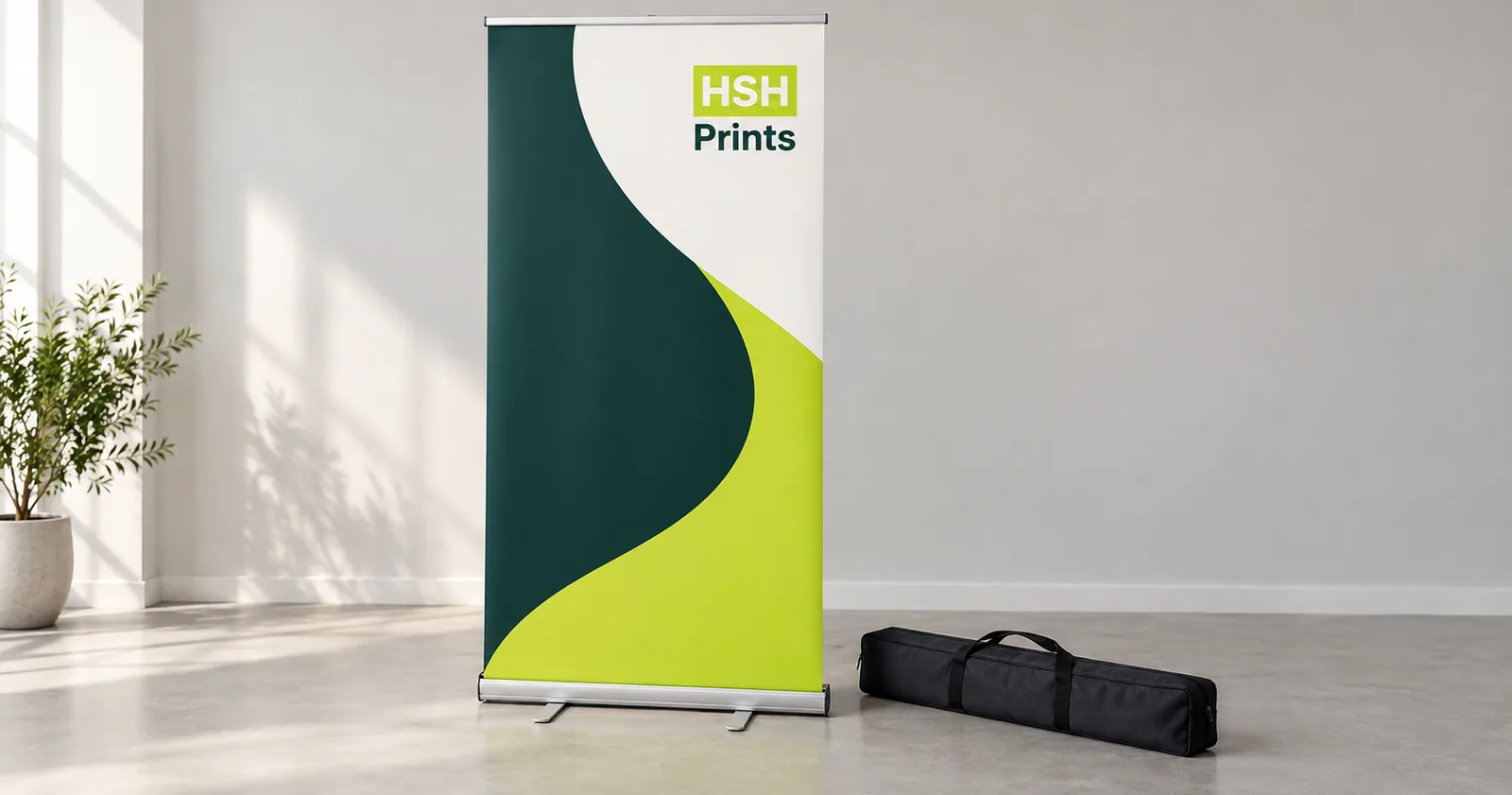 A retractable pull-up banner standing beside its carry bag