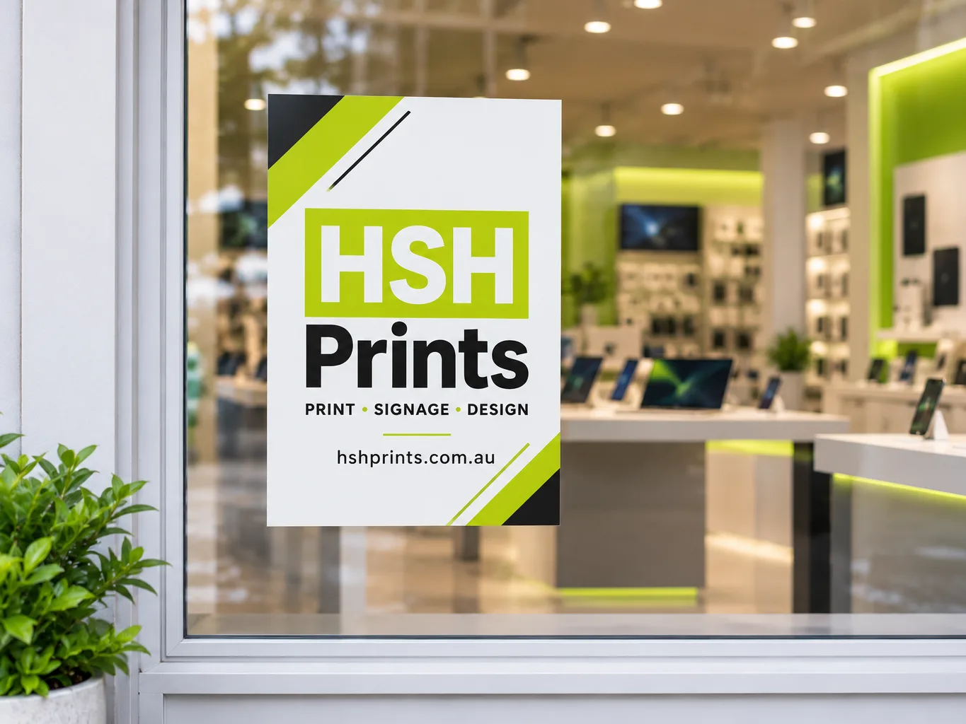 Mockup of an HSH window decal in white, lime and black on a shopfront glass, seen from the street